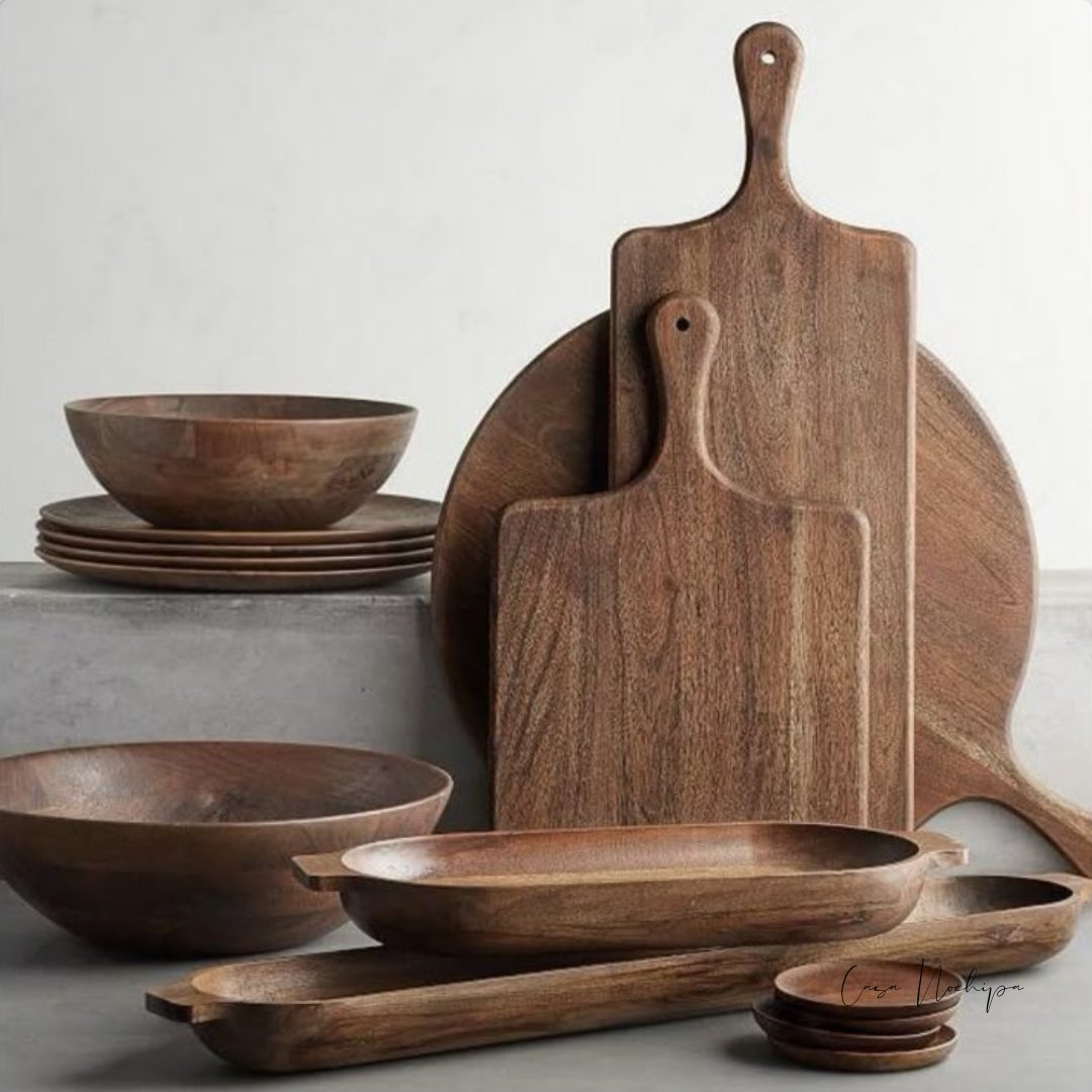 Utensilios de cocina artesanales de madera de tzalam hechos a mano, diseñados por artesanos mexicanos, mostrando cucharones, espátulas y tenedores sostenibles ideales para el hogar.