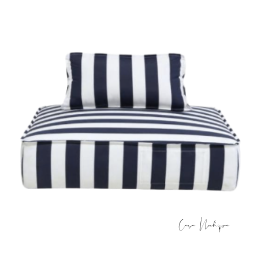 Sillón lounge compacto para exterior con cojín cilíndrico y respaldo tapizado en tela Sunbrella rayada
